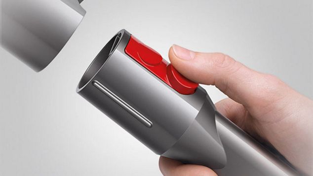 a hand touching the red button