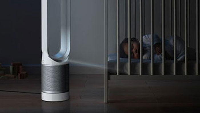 Dyson Pure Cool Link beside baby in a cot
