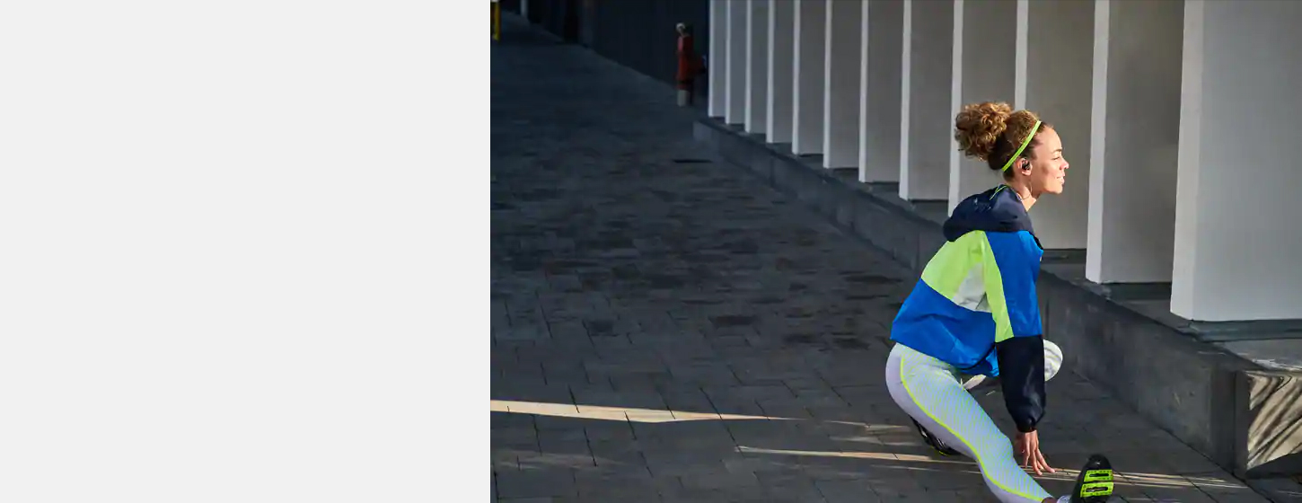 A girl wears JBL Reflect Contour 2 Secure fit Wireless Sport Headphones