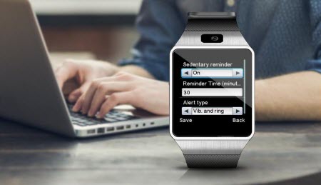 Smart Watch and a man typing on his laptop