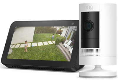 Front view of a Stick Up Cam Battery and an Echo Show, all angled slightly to the left