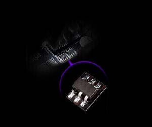 A corner of the motherboard, with closeup of a chip