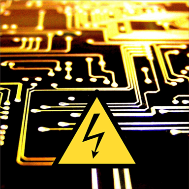 Tracing on PCB with warning sign at the bottom