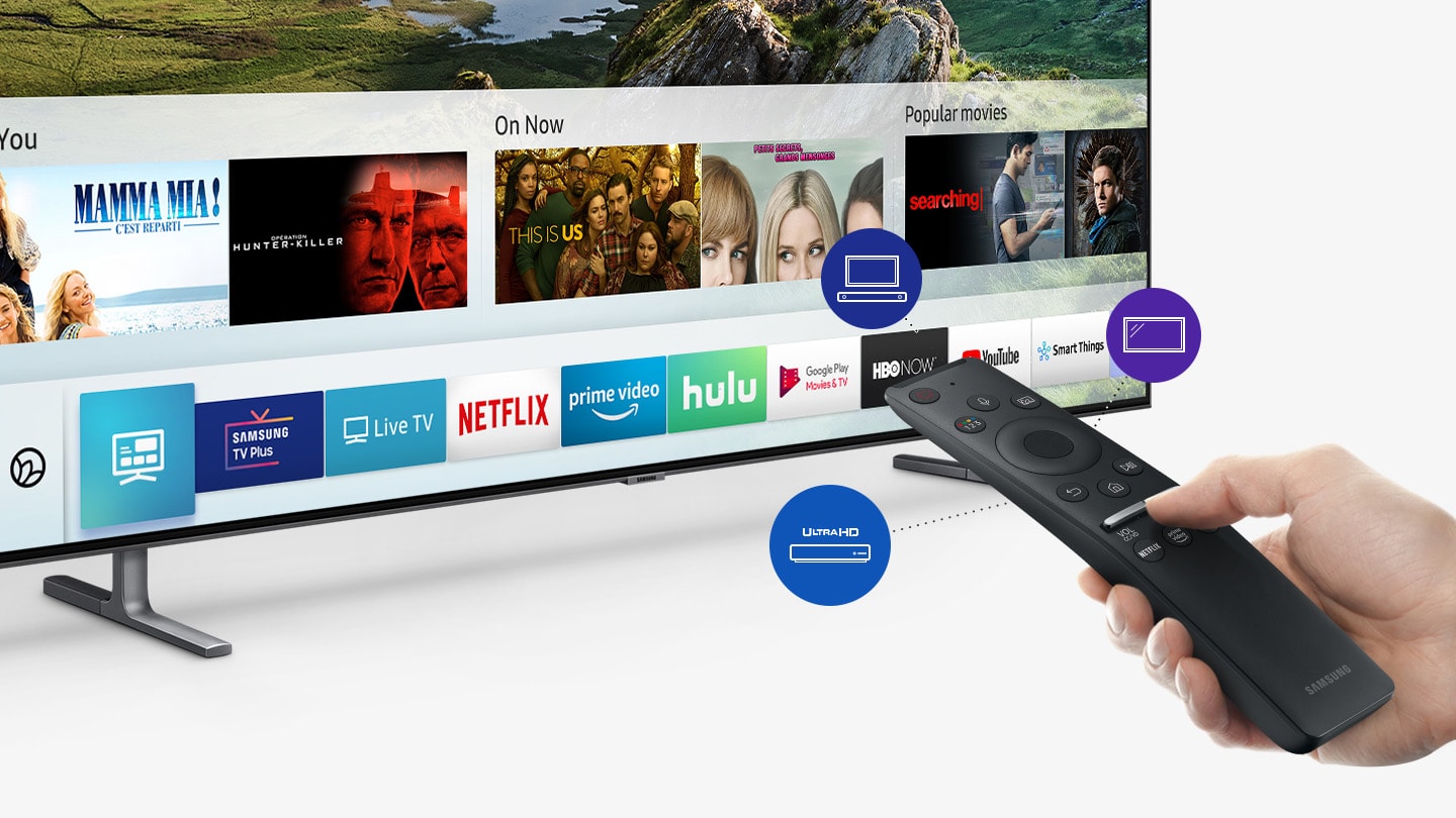 Hand holding a remote pointed towards a SAMSUNG Q80R angled down to the right, showing Title cards and app cards for shows and streaming services