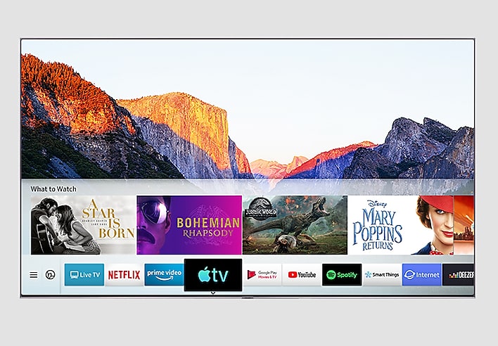 SAMSUNG Q80R Facing Forward with a National Park Mountain Range Background and What to Watch Movie Title Cards and logo + title cards streaming services