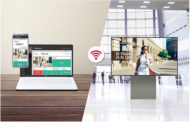 LG display ad at an airport lobby, connecting via WiFi to a smartphone and open laptop in another location