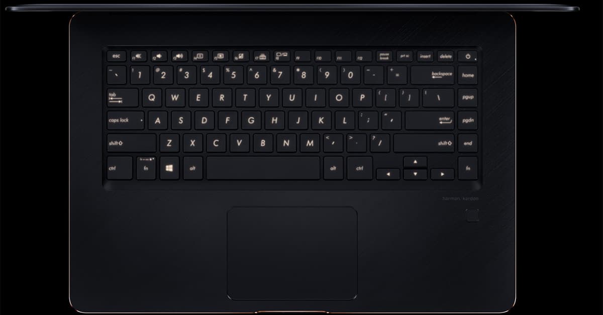Overhead view of an open ASUS ZenBook Pro 15 UX550GE laptop with focus on the keyboard and touchpad
