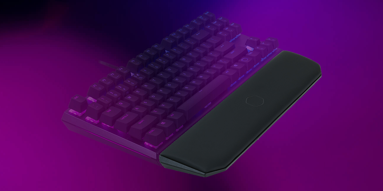 Purple background with the MK730 and its wrist rest. The wrist rest is in focus.