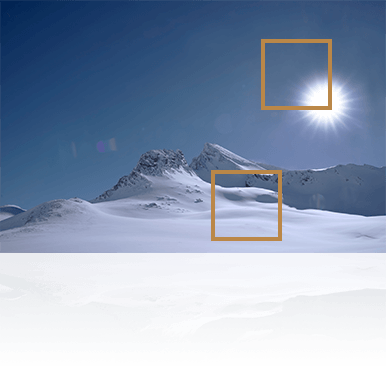 detail of the sun and snow mountain