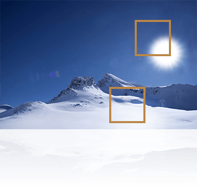 detail of the sun and snow mountain