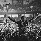 A Singer Facing a Stadium Full of Fans