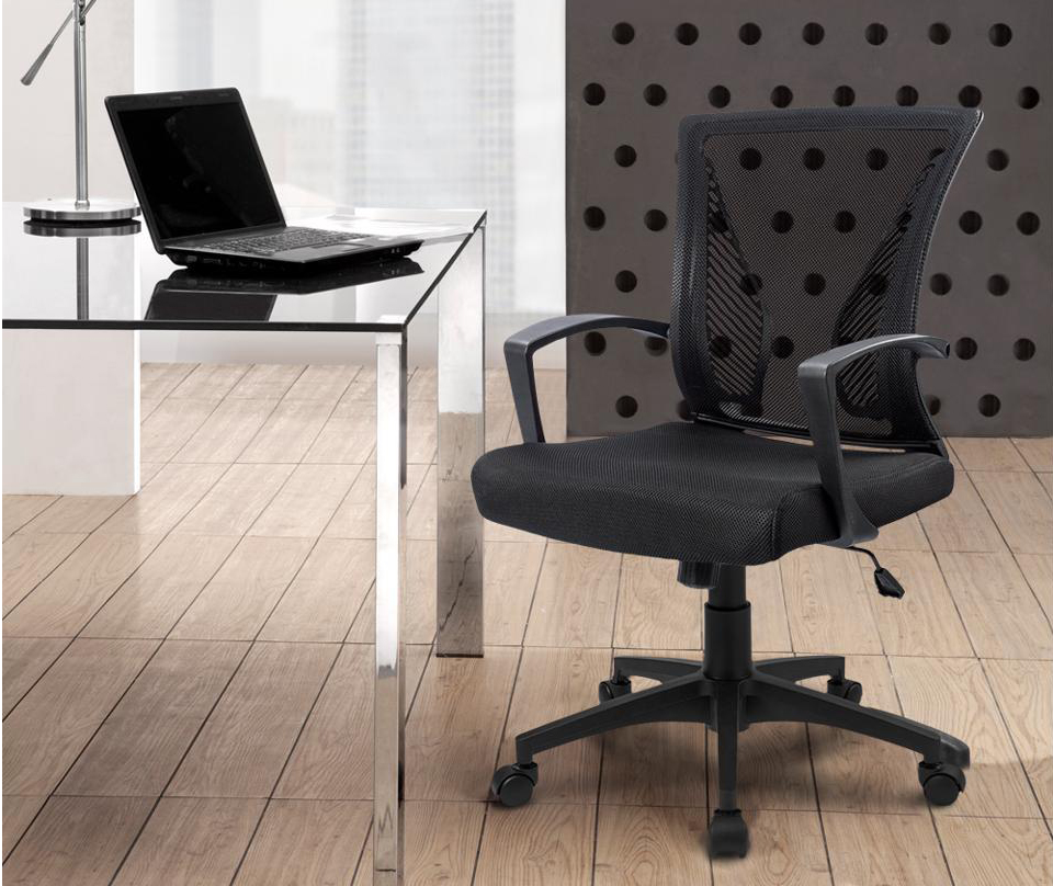 The chair is in front of desk in a corner office.