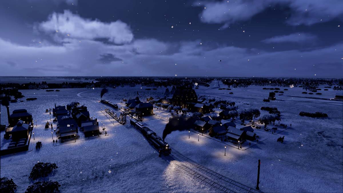 Birds eye view of a train billowing black smoke and leaving a small snowy town