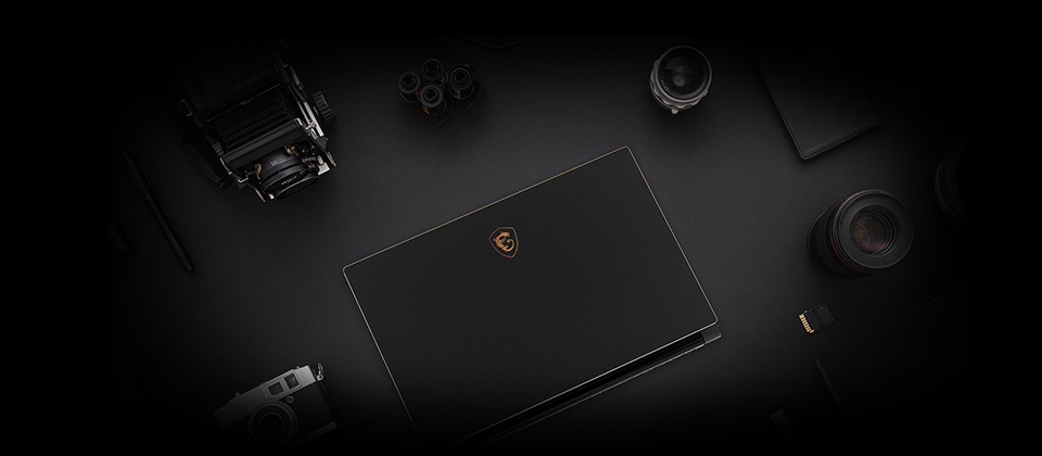 View from above, accessories around GS65 laptop.