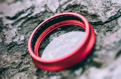 The rear of a filter placed on the rock, showing lining around the ring