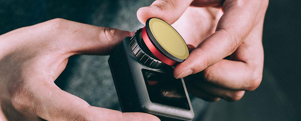 A filter being attached to the lens of Osmo Action camera