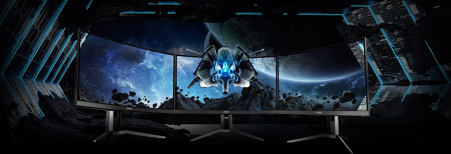 three monitors side-by-side with a space image as screen