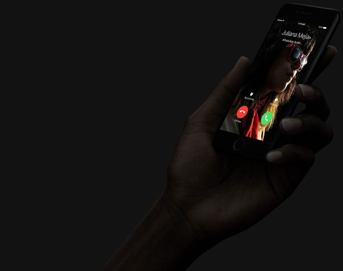 a hand holding iPhone 7 answering a phone call