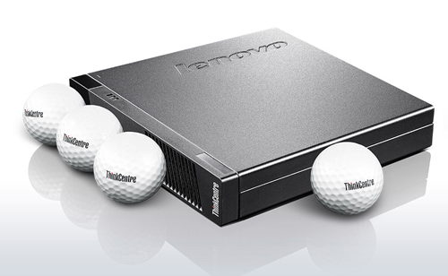 Four golf balls are surrounding around a desktop PC