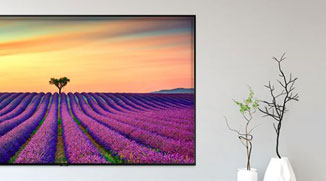 Artwork being displayed full screen on a wall-mounted Samsung Q70R display