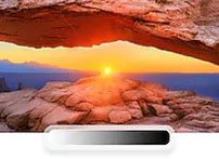 A sunset occurring in the middle of desert canyon rocks