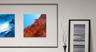 Mounted Samsung Q70R display showing two pictures