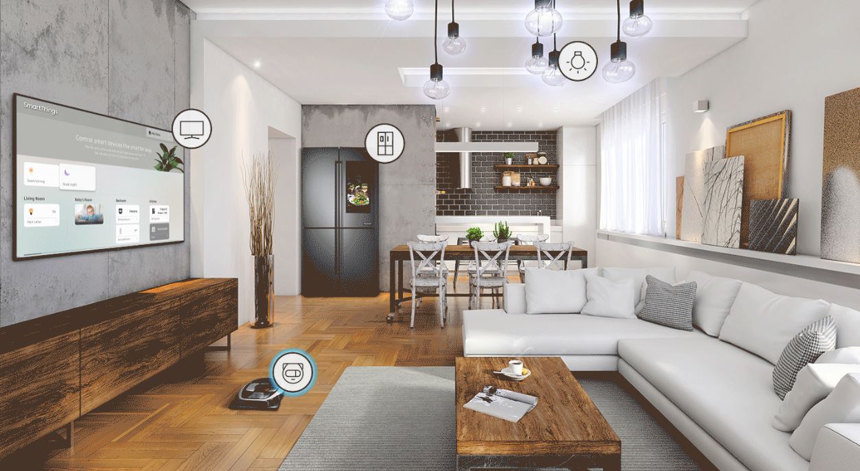 Smart Home living room with the Samsung Q70R mounted, next to a robot vaccum, smart fridge and smart lighting