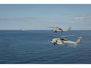 MH-60R Sea Hawk helicopters launch AGM-114 hellfire missiles Poster Print (34 x 22) MH-60R Sea Hawk helicopters launch AGM-114 hellfire missiles Poster Print (34 x 22)