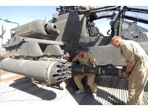Aircrew loading an AGM-114 Hellfire missile onto an Apache helicopter Poster Print (34 x 22) Aircrew loading an AGM-114 Hellfire missile onto an Apache helicopter Poster Print (34 x 22)