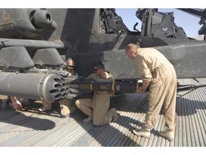 Aircrew loading an AGM-114 Hellfire missile onto an Apache helicopter Poster Print (34 x 22) Aircrew loading an AGM-114 Hellfire missile onto an Apache helicopter Poster Print (34 x 22)