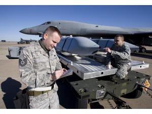 Weapons loaders inspect an AGM-158 JASSM Poster Print (34 x 23) Weapons loaders inspect an AGM-158 JASSM Poster Print (34 x 23)