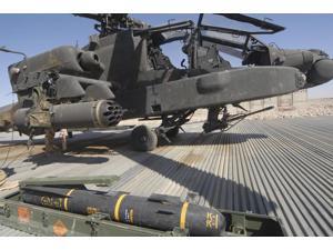 An AGM-114 Hellfire missile is ready to be loaded onto an AH-64 Apache Poster Print (34 x 22) An AGM-114 Hellfire missile is ready to be loaded onto an AH-64 Apache Poster Print (34 x 22)