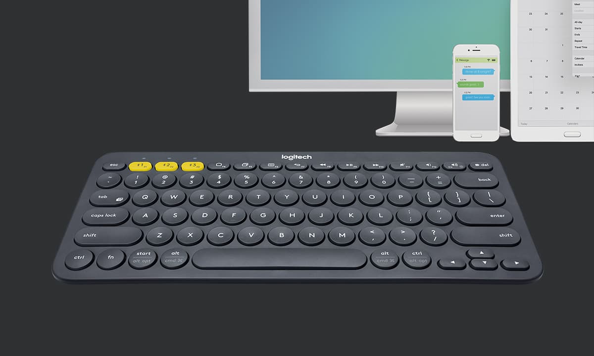 Logitech K380 keyboard beside three compatible devices