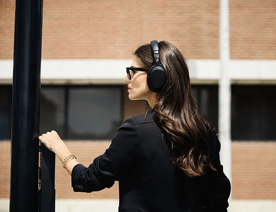 A girl wore Sennheiser PXC 550-II Over-ear Wireless Headphone