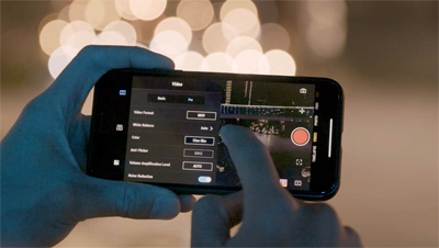 Closeup shot of someone using a smartphone to edit their Osmo Pocket shots