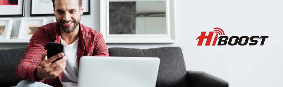 HiBoost 10K Smart Link Banner Showing a Man on His Living Room Couch in Front of his open laptop, smiling at the phone in his hand