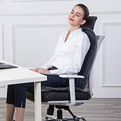 Demonstration of the cushion on an office chair . with a female reclining on the cushion