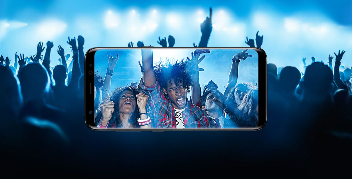 Horizontal Samsung Galaxy S8 Phone in Horizontal Position Showing Fans Rocking Out at a Live Concert