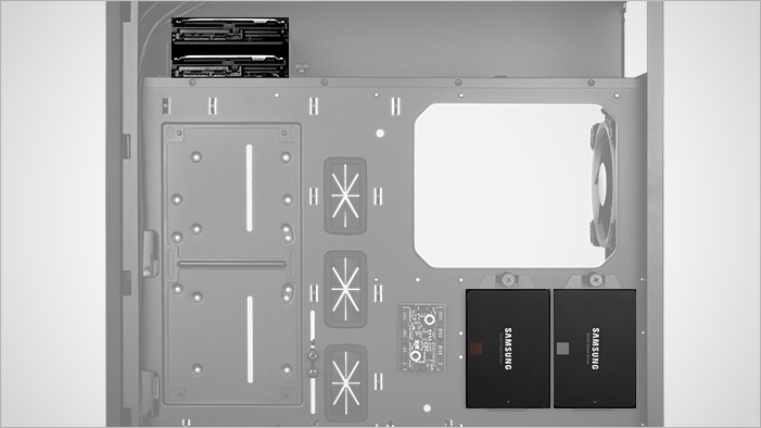 Transparent Rosewill ATX Mid Tower Gaming PC Computer Case Facing to the Right with Its Side Panel Removed a Focus on the HDD Bays