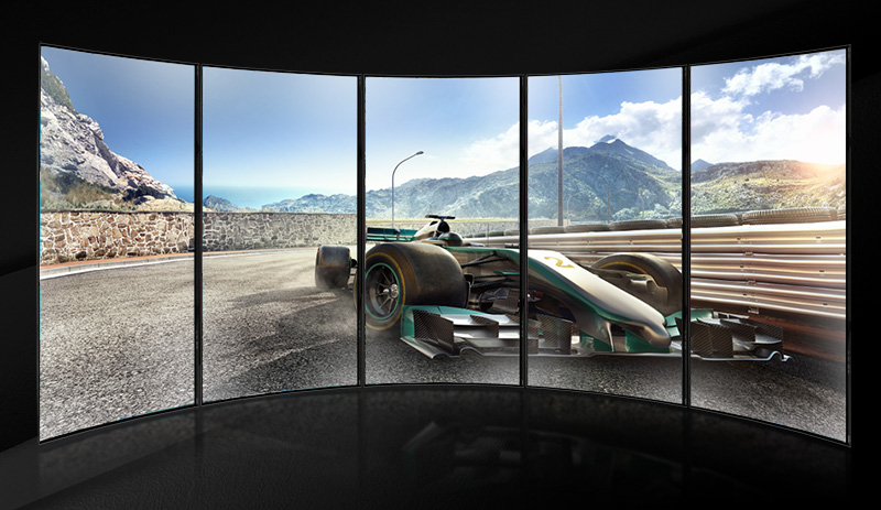 mutiple monitors showing a racing car picture powred by AMD Eyefinity Technology