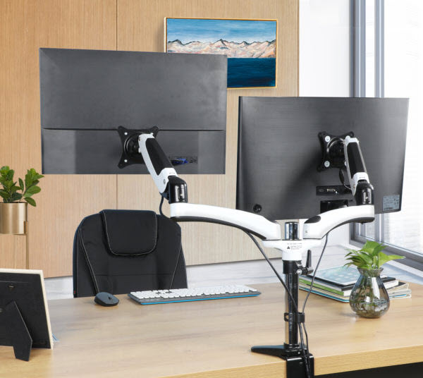 HUANUO HNDSK1 dual monitor stand hides cables of two monitors in an office