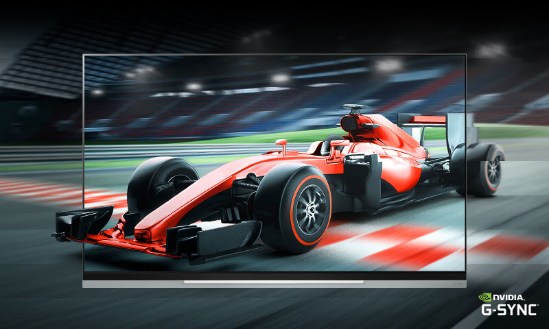 LG B9 Smart OLED TV showing a red F1 racing car