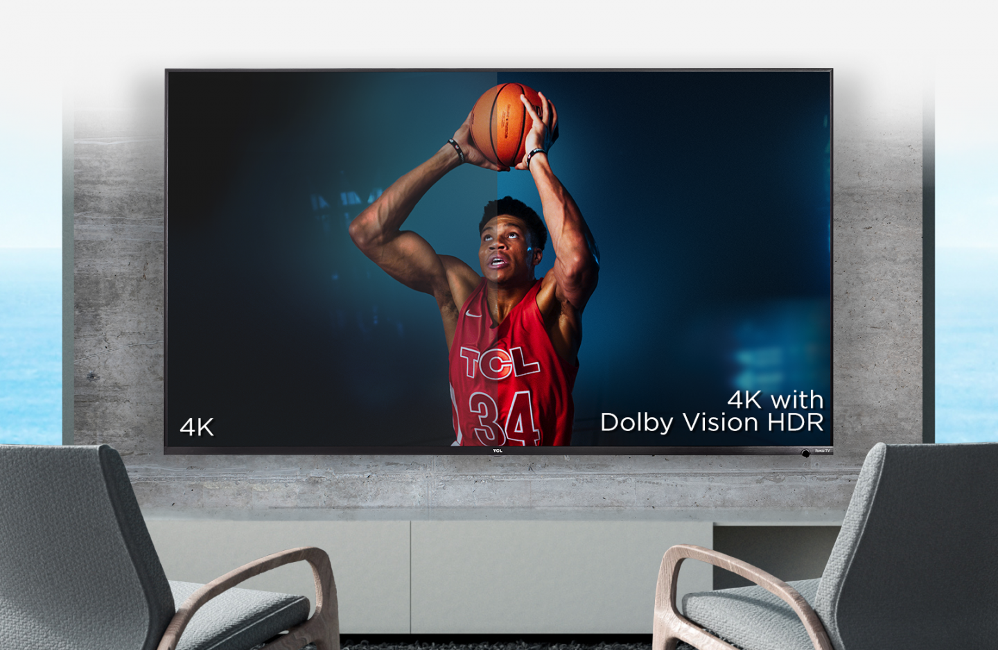 TCL 65R617 Smart LED Roku Smart TV is hung on the wall and the athlete holds the basketball high