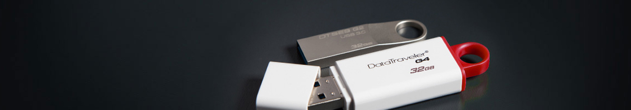 Kingston DataTraveler 32GB stick next to another kingston thumb drive