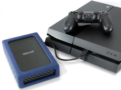 A Novus connected to a PS4, with a Dual Shock controller placed on the PS4