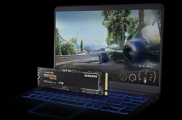 V-NAND pcie memory on top of a laptop showing a racing game