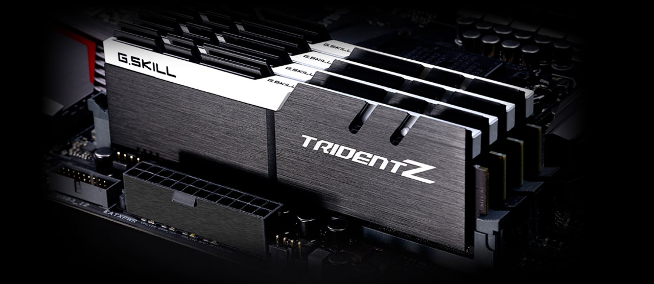  Four Trident Z memory modules installed on a motherboard, all with black heat spreader and white accent bar  