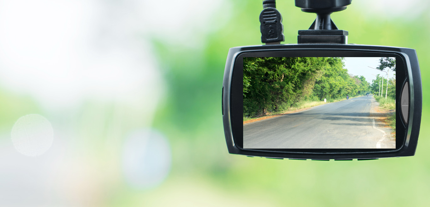 Dash Cam Showing a Road Surrounded by Trees