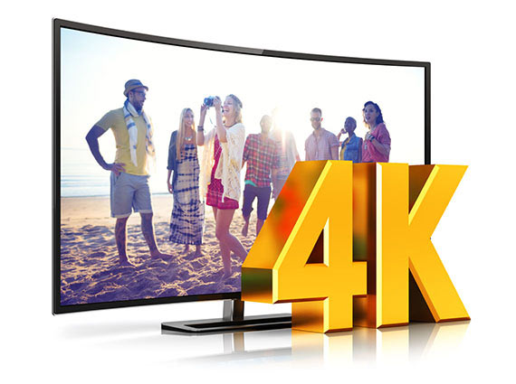 Monitor Showing Friends Hanging Out on the Beach with a Graphic That Reads 4K in Front