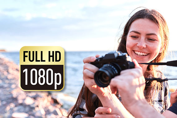 A girl holding a camera recording full HD video